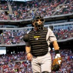 Astros catcher Pudge Rodriguez walking urgently off the field